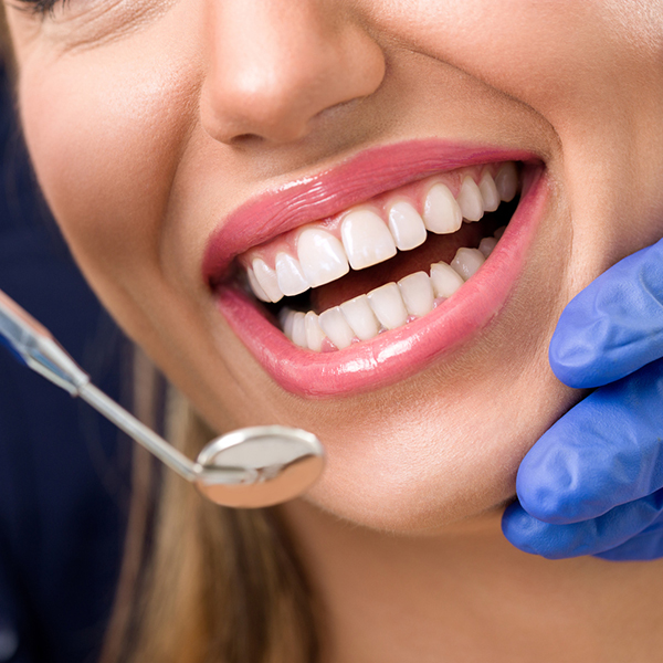 Smiling woman at dentist